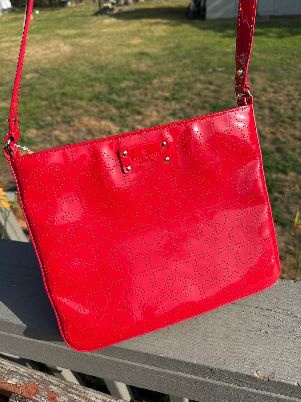 kate spade red patent heart-perforated crossbody bag